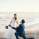 Man serenading woman on beach